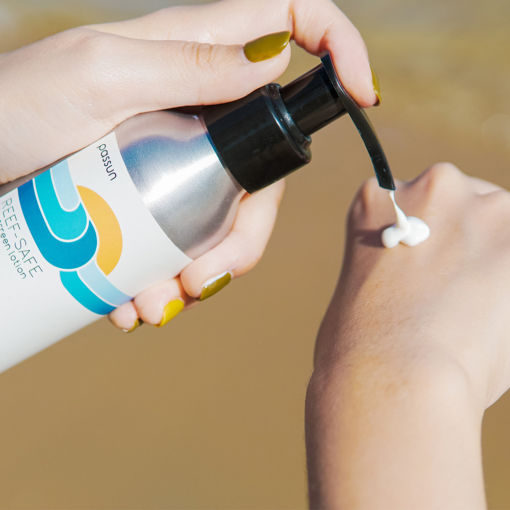PASSUN Sunscreen in Pump Bottle with white cream on a hand Squared